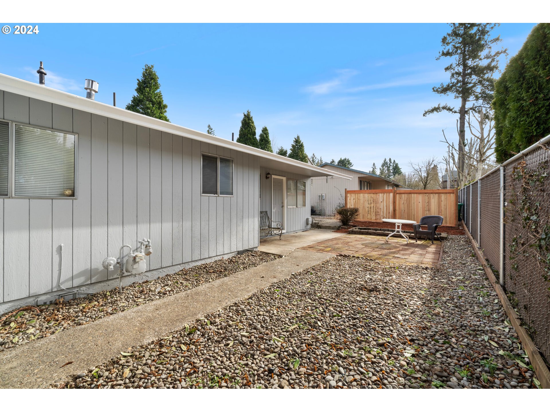 12841 Southeast Foster Road Portland, OR 97236 - Photo 17 of 48 a view of a house with backyard and sitting area