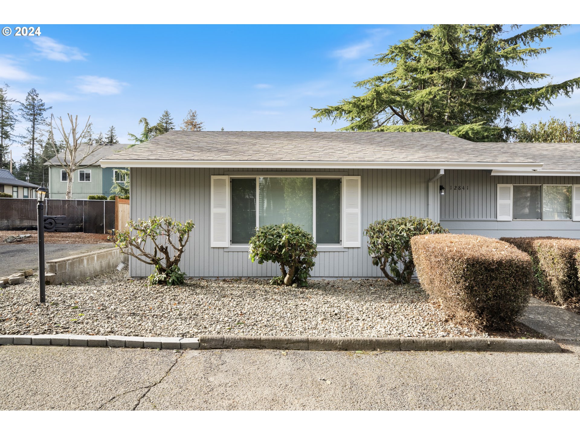 12841 Southeast Foster Road Portland, OR 97236 - Photo 4 of 48 a front view of a house with porch