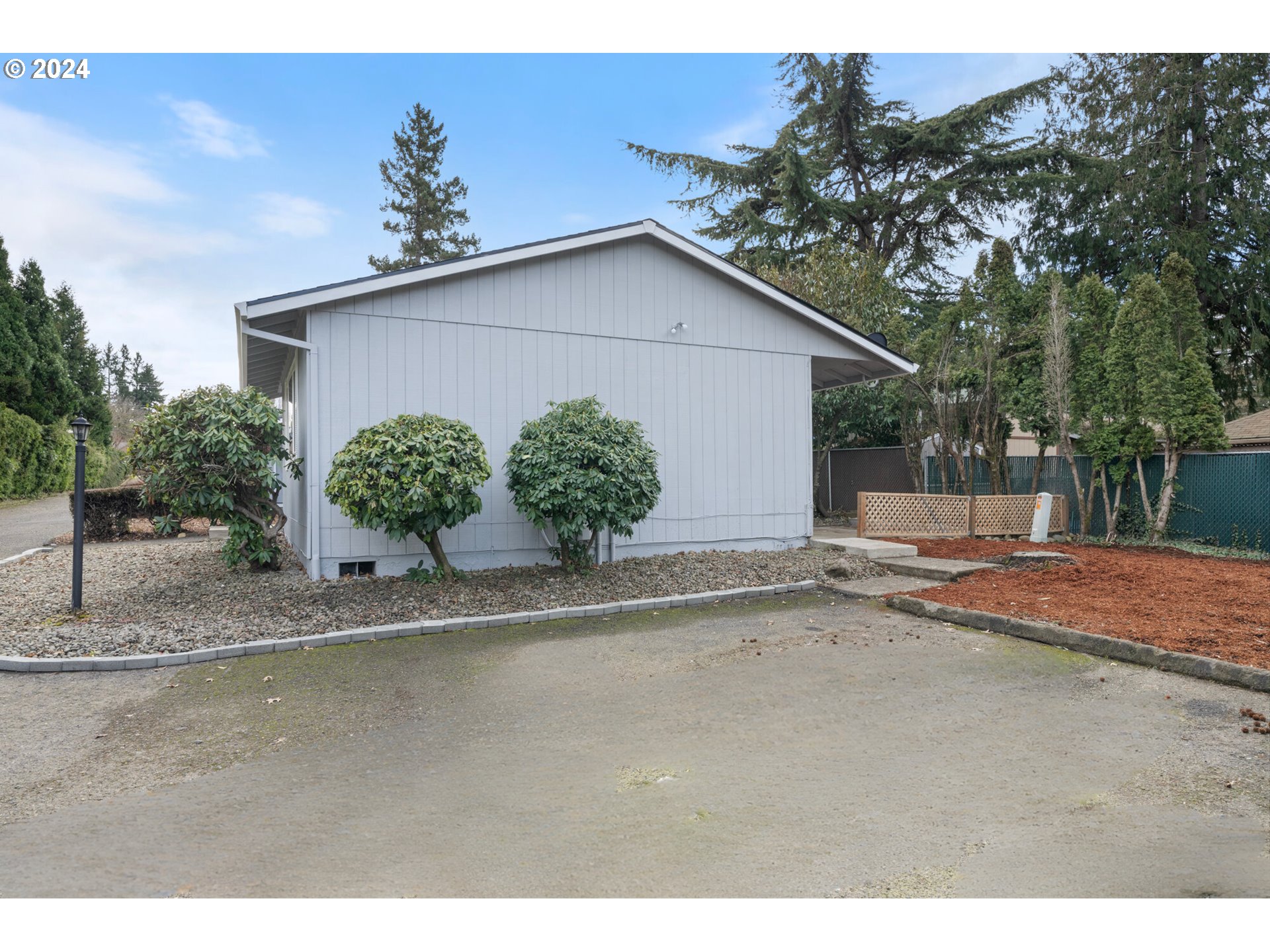 12841 Southeast Foster Road Portland, OR 97236 - Photo 10 of 48 a view of a house with a yard and garage