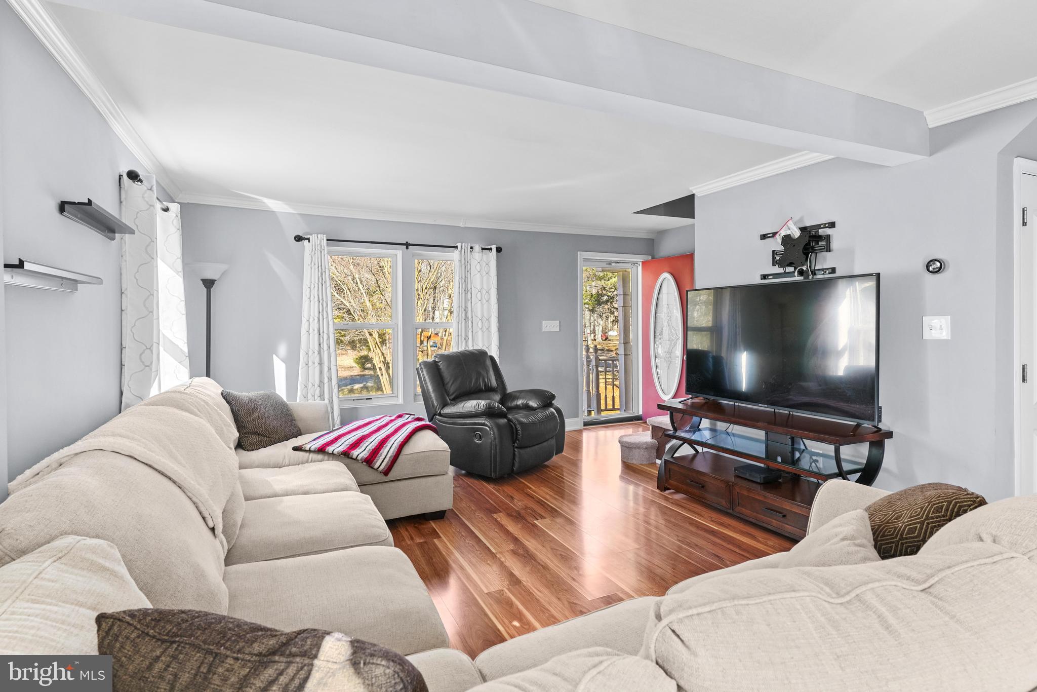 1435 Shadyrest Road Shady Side, MD 20764 - Photo 14 of 36 a living room with furniture and a flat screen tv