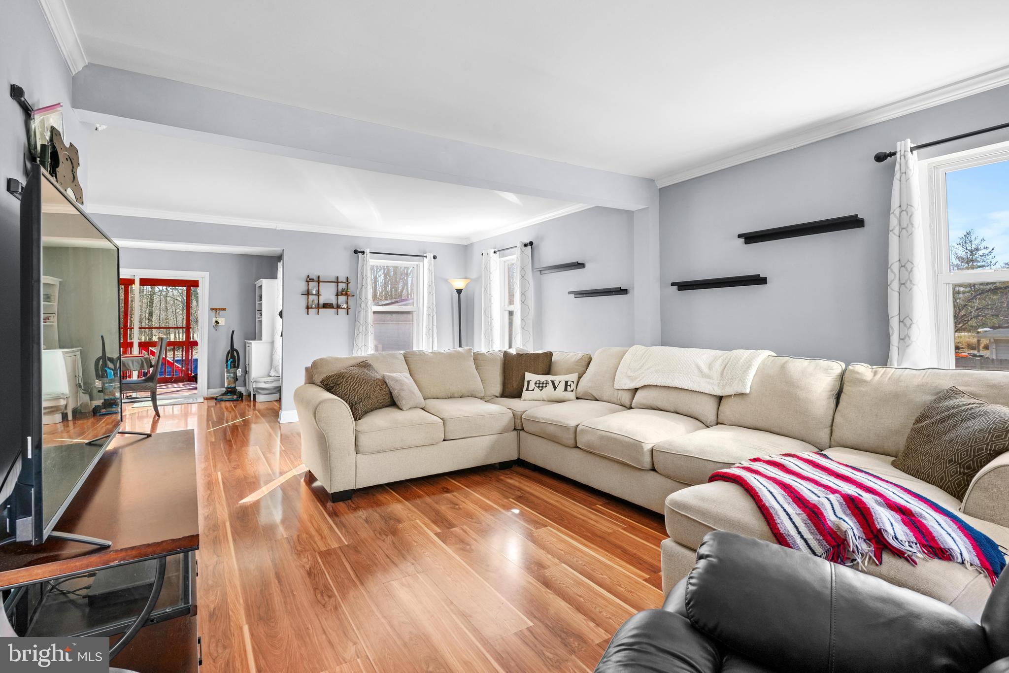 1435 Shadyrest Road Shady Side, MD 20764 - Photo 15 of 36 a living room with furniture and a wooden floor