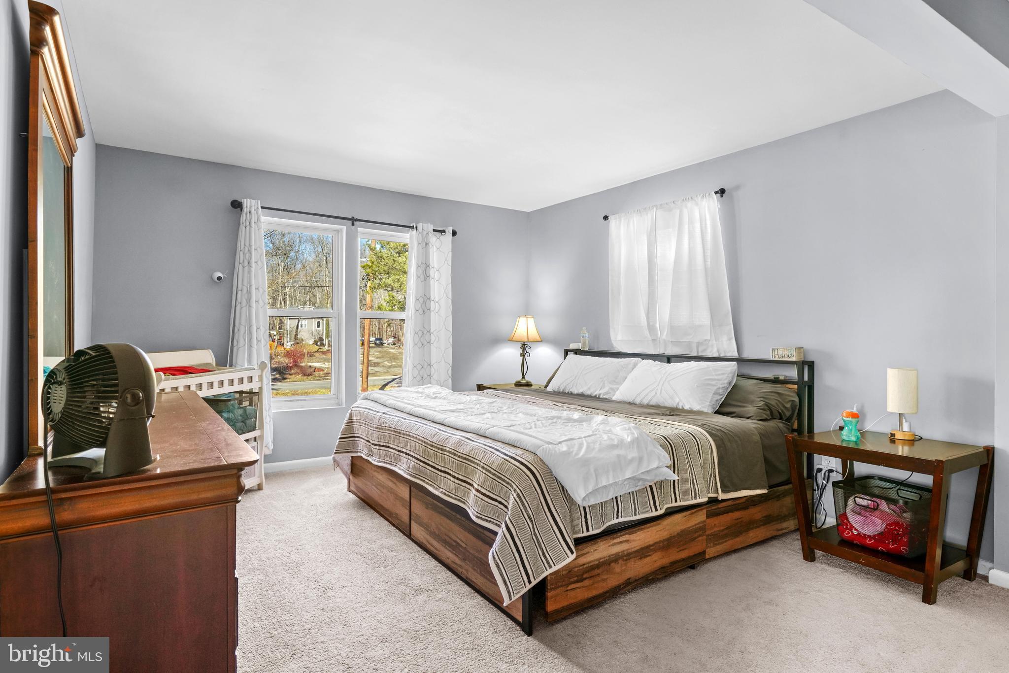 1435 Shadyrest Road Shady Side, MD 20764 - Photo 16 of 36 a bedroom with a bed and a dresser next to a window