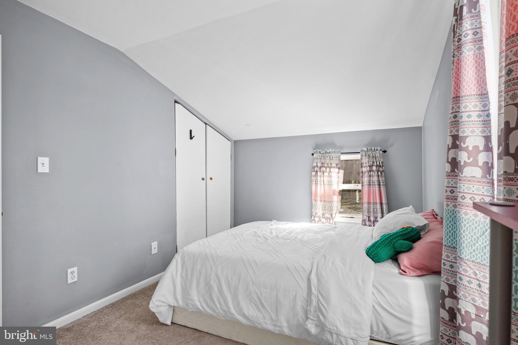 1435 Shadyrest Road Shady Side, MD 20764 - Photo 23 of 36 a spacious bedroom with a bed and a window