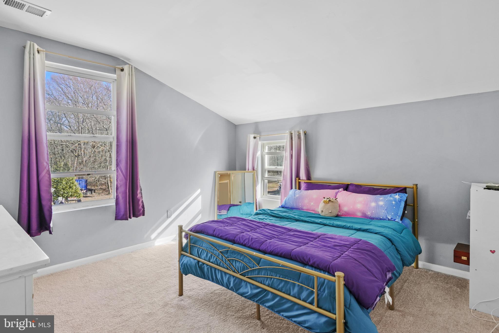 1435 Shadyrest Road Shady Side, MD 20764 - Photo 24 of 36 a bedroom with a bed and wooden floor