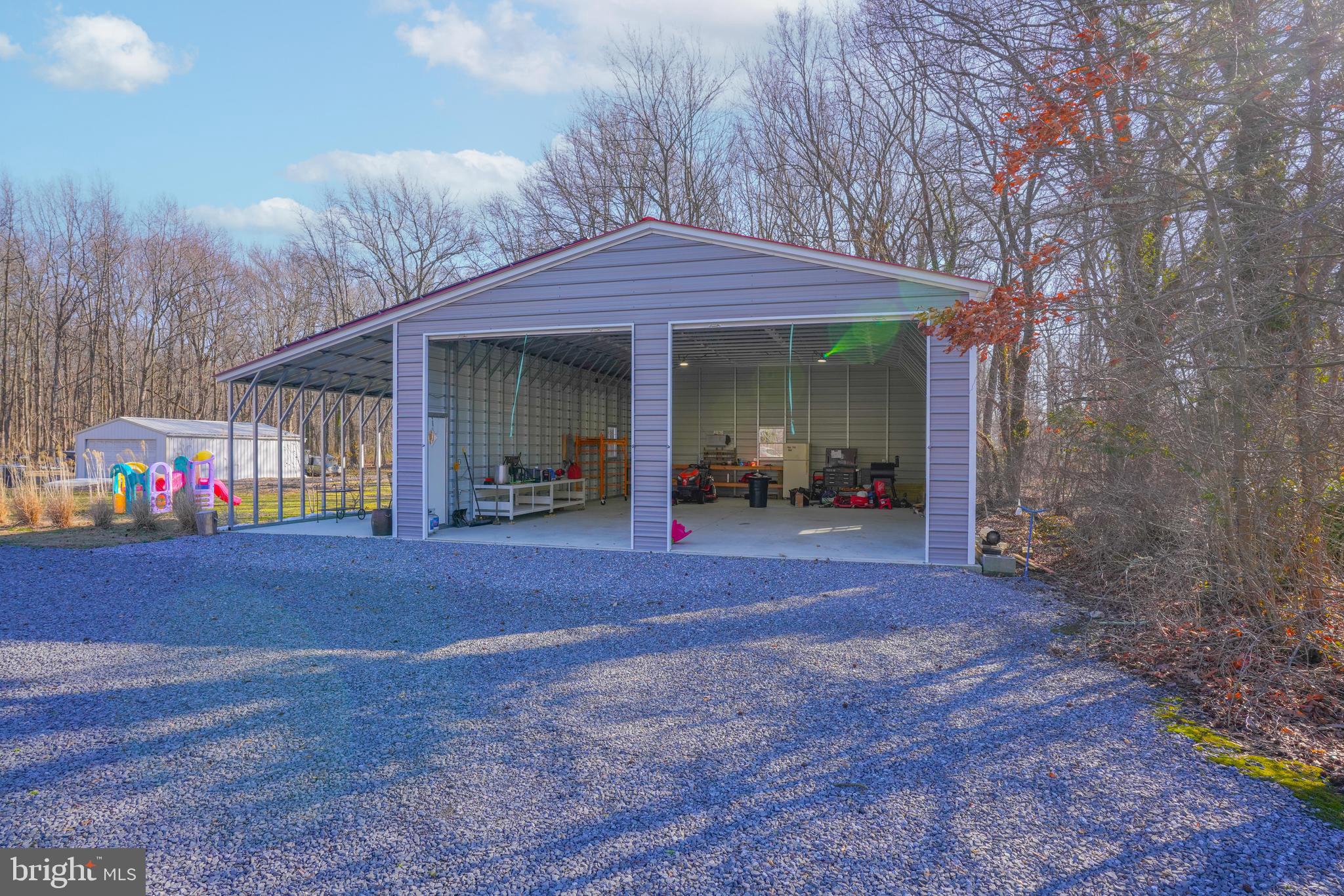 1435 Shadyrest Road Shady Side, MD 20764 - Photo 5 of 36 a view of a house with backyard and porch