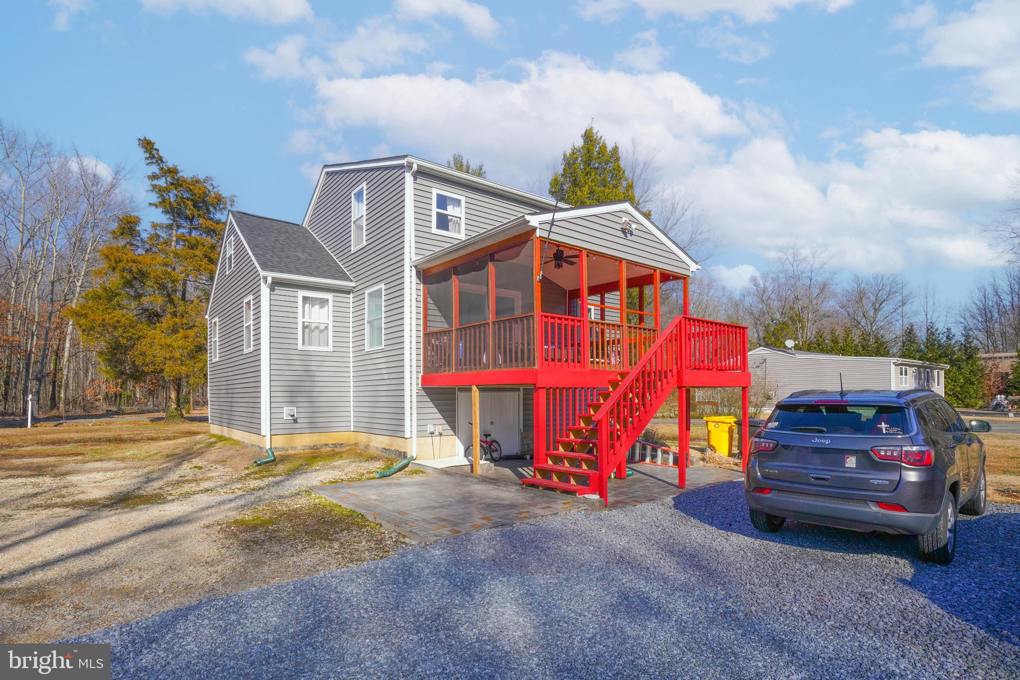 1435 Shadyrest Road Shady Side, MD 20764 - Photo 8 of 36 a front view of a house with garden