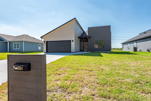 a bathroom with a sink and a large mirror