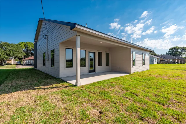 a house view with a backyard space