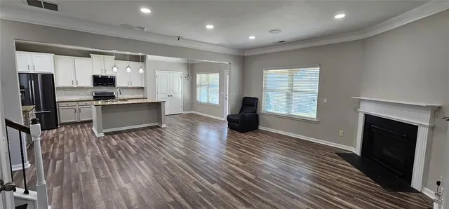 a bathroom with a double vanity sink a toilet and shower