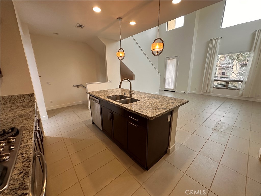 27 Soho Irvine, CA 92612 - Photo 12 of 69 a kitchen with a sink a counter top space and a window