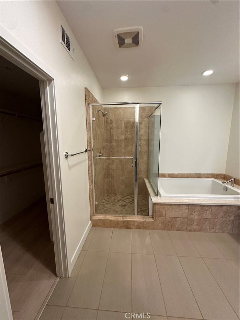 27 Soho Irvine, CA 92612 - Photo 19 of 69 a bathroom with a shower and a glass door