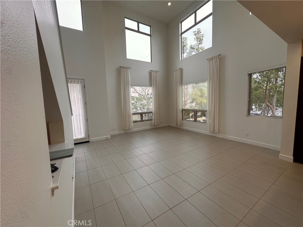 27 Soho Irvine, CA 92612 - Photo 2 of 69 a view of an empty room with a fireplace and a window