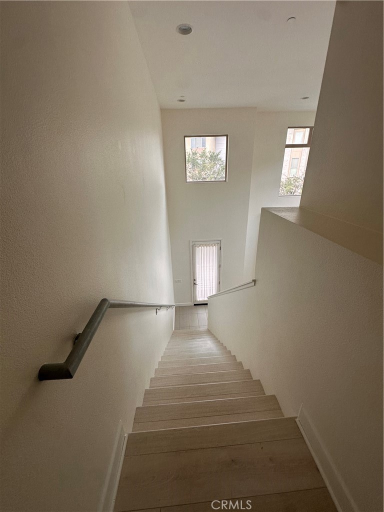 27 Soho Irvine, CA 92612 - Photo 21 of 69 a view of entryway and hall with wooden floor