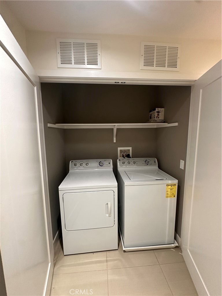 27 Soho Irvine, CA 92612 - Photo 26 of 69 a utility room with dryer and washer