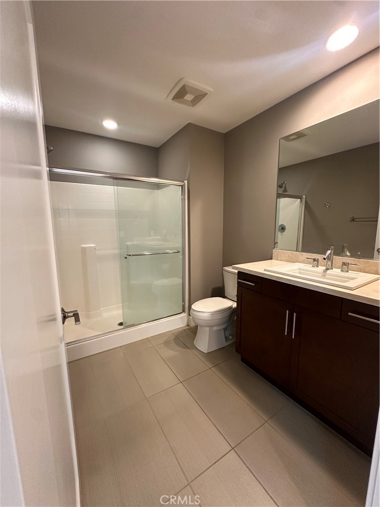 27 Soho Irvine, CA 92612 - Photo 34 of 69 a bathroom with a toilet sink and mirror