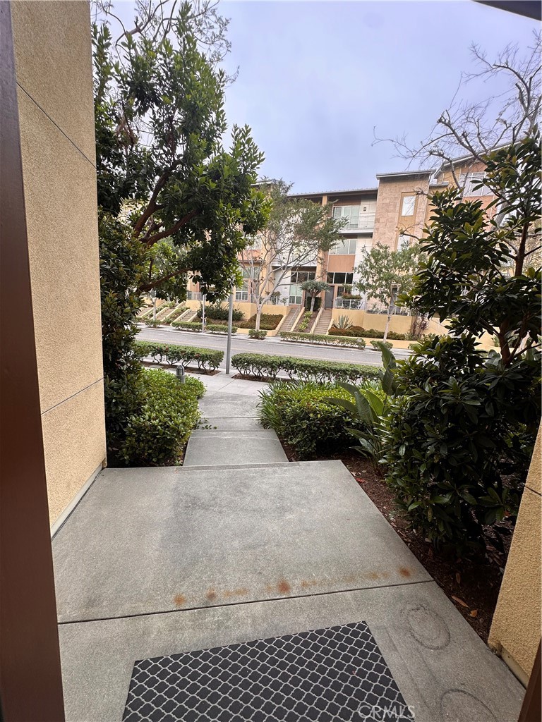 27 Soho Irvine, CA 92612 - Photo 44 of 69 a view of a patio with table and chairs and potted plants