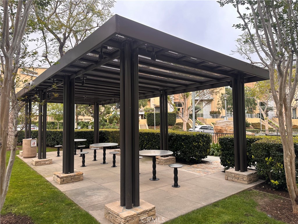 27 Soho Irvine, CA 92612 - Photo 50 of 69 a view of a patio with a table chairs and a backyard