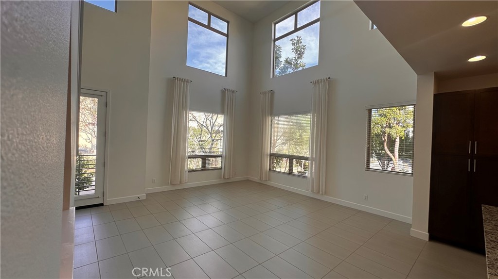 27 Soho Irvine, CA 92612 - Photo 6 of 69 a view of an empty room with glass door and windows