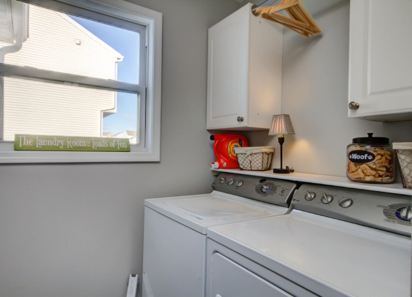 8580 Haystack Southeast Caledonia, MI 49316 - Photo 26 of 27 Laundry room with storage cabinets
