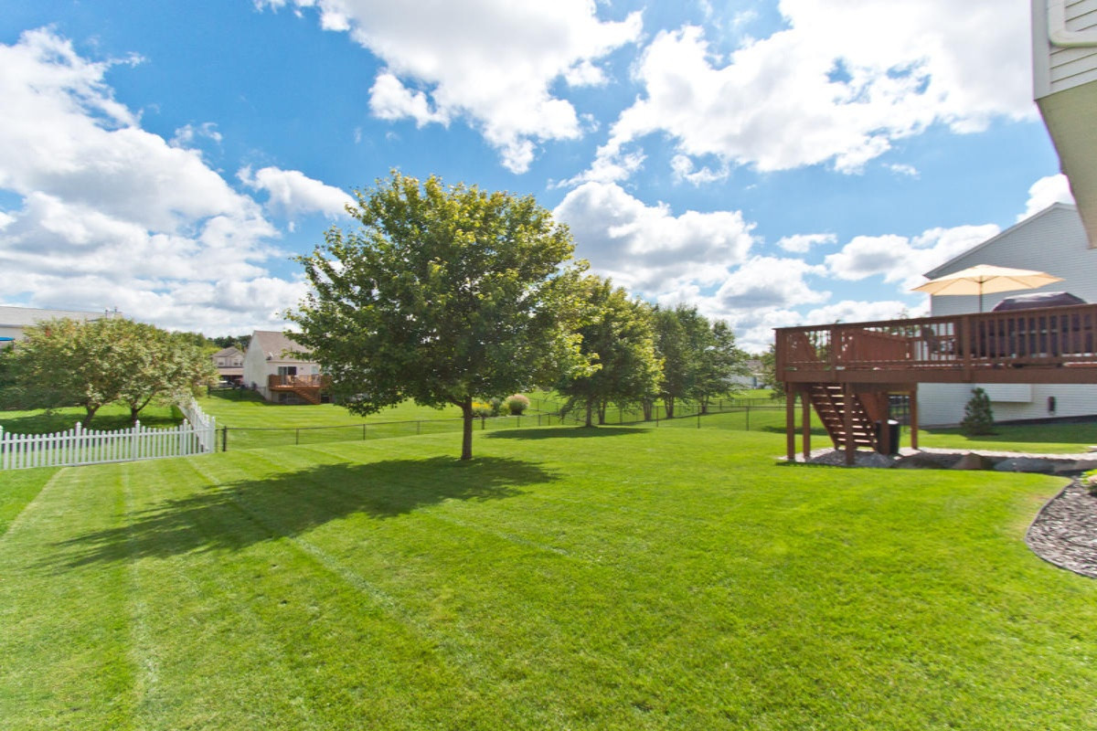 8580 Haystack Southeast Caledonia, MI 49316 - Photo 4 of 27 Deck & back yard