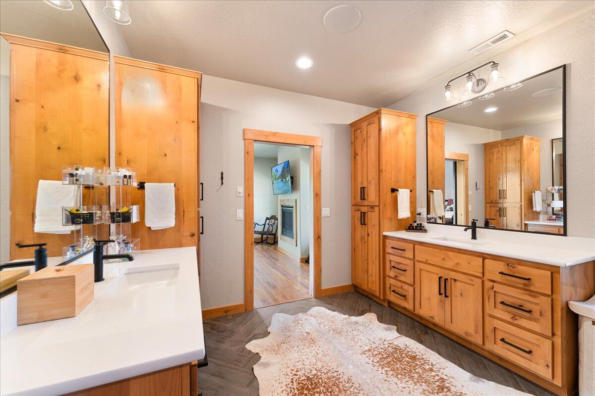 2220 Butte Falls Highway Eagle Point, OR 97524 - Photo 32 of 69 a large bathroom with a large mirror vanity and shower