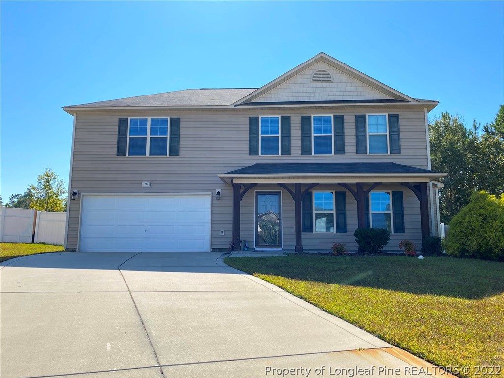 76 Loyalist Road Cameron, NC 28326 - Photo 1 of 34 a front view of a house with yard