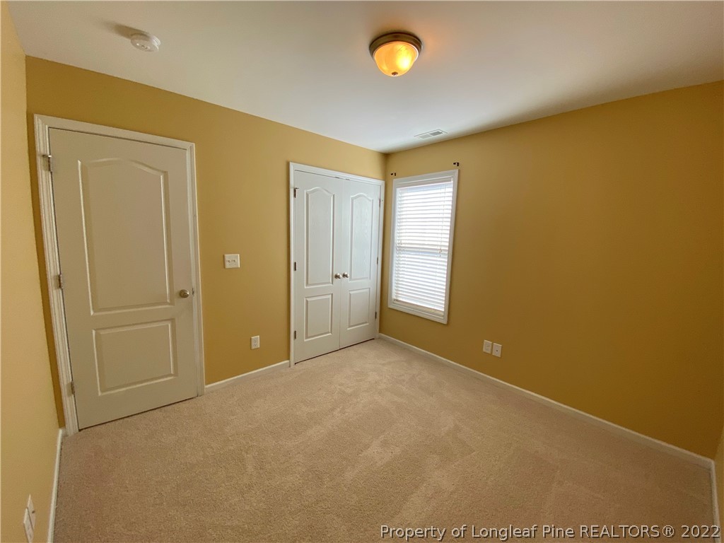 76 Loyalist Road Cameron, NC 28326 - Photo 14 of 34 an empty room with windows