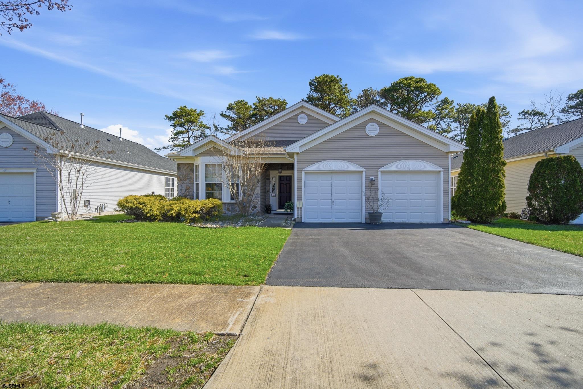 102 Warwick Road Galloway Township, NJ 08205 - Photo 2 of 45 a front view of a house with a garden