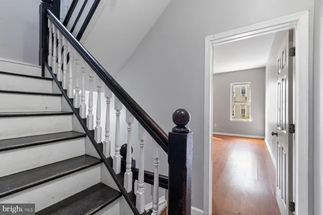 a view of an entryway with wooden floor