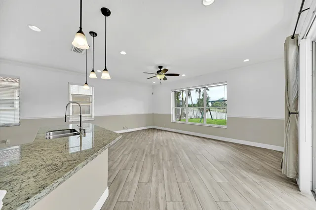 a view of livingroom with hardwood floor and a ceiling fan