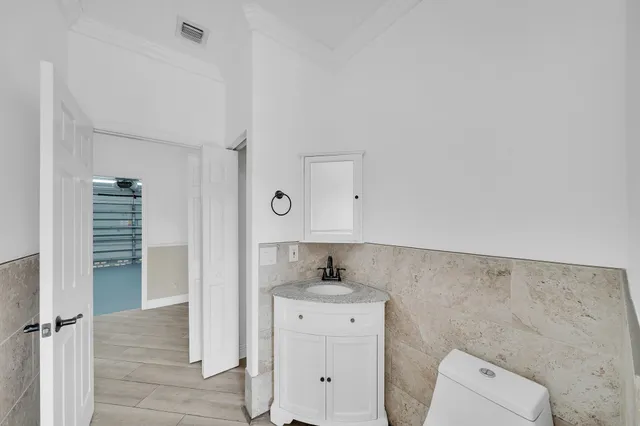a view of a hallway view with wooden floor and staircase