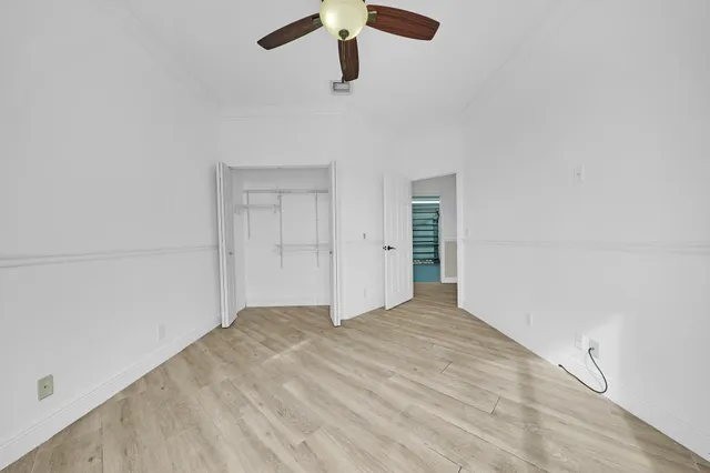 a view of an empty room with windows