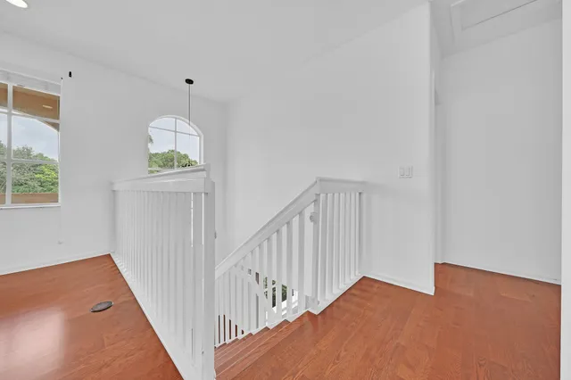 an aerial view of a house with outdoor space and lake view