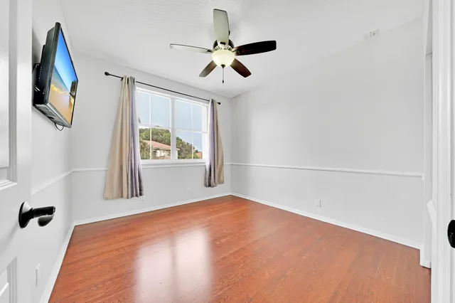 an aerial view of a house with a garden and swimming pool