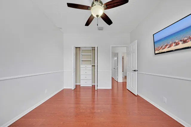 an aerial view of a house with a garden and lake view