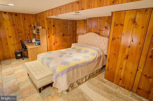 a bedroom with a bed and a table