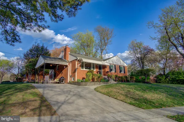 a view of a porch with a table and chairs