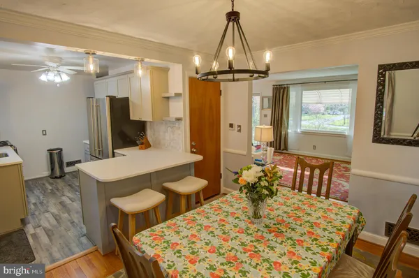 a view of kitchen island with granite countertop furniture and stainless steel appliances