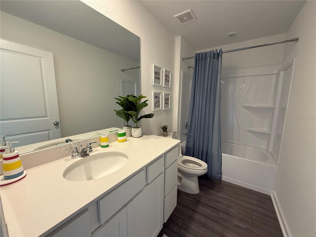 4220 Southwest 82nd Lane Ocala, FL 34476 - Photo 12 of 18 a bathroom with a sink and a mirror