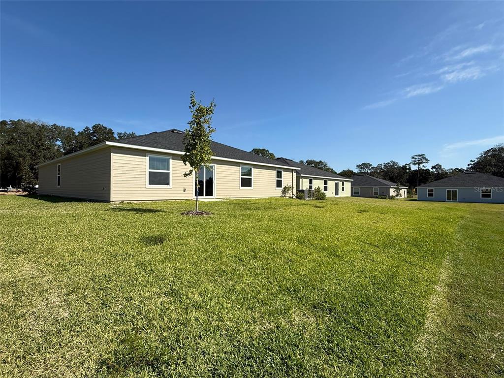 4220 Southwest 82nd Lane Ocala, FL 34476 - Photo 17 of 18 a front view of a house with garden