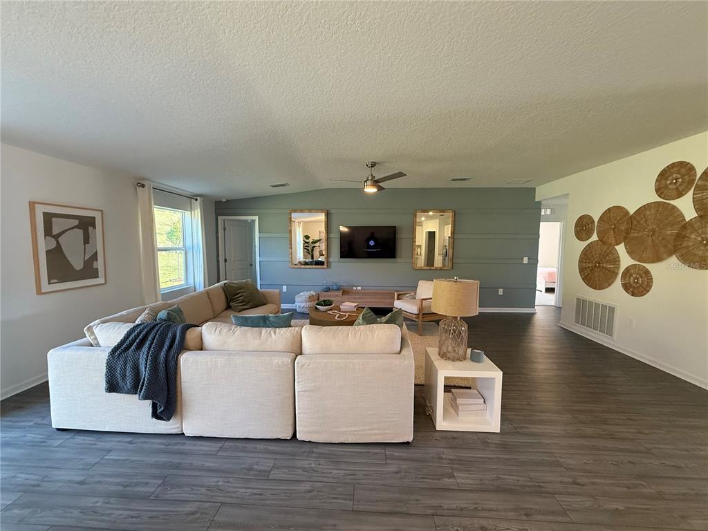 4220 Southwest 82nd Lane Ocala, FL 34476 - Photo 4 of 18 a living room with furniture and a wooden floor