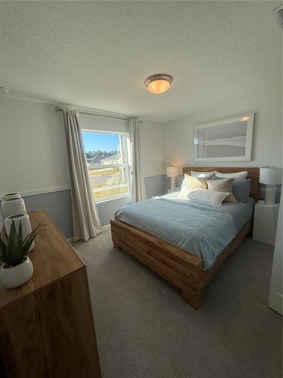 4220 Southwest 82nd Lane Ocala, FL 34476 - Photo 9 of 18 a bedroom with a bed and window