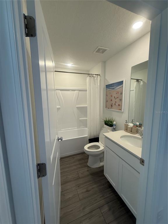 4220 Southwest 82nd Lane Ocala, FL 34476 - Photo 10 of 18 a bathroom with a sink a toilet and shower