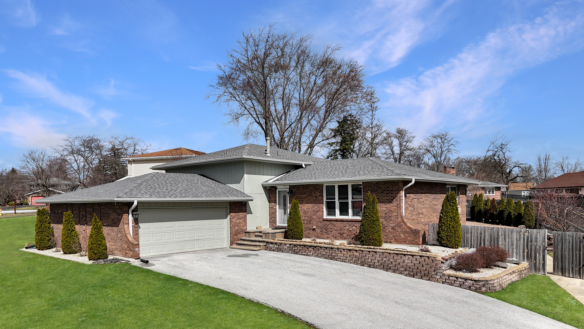 front view of a house with a yard