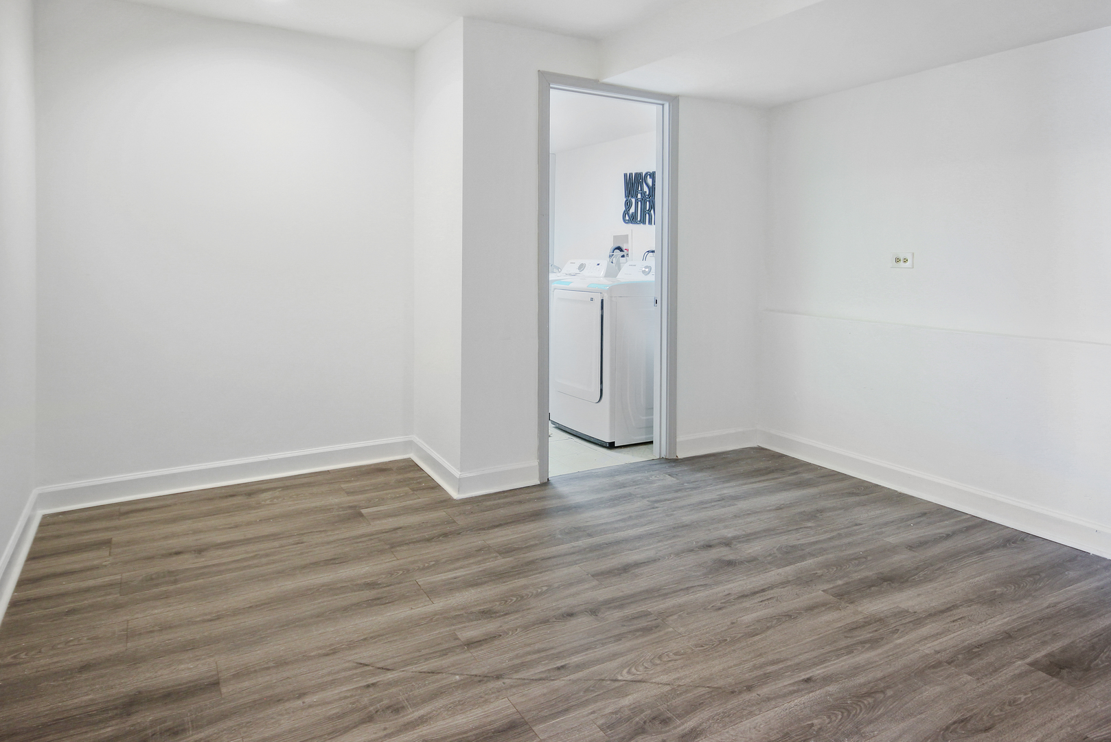 2938 East Shagbark Trail Crete, IL 60417 - Photo 13 of 22 a view of an empty room with wooden floor
