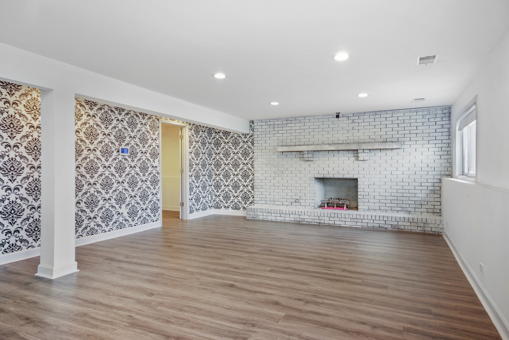 2938 East Shagbark Trail Crete, IL 60417 - Photo 10 of 22 wooden floor in an empty room with a fireplace