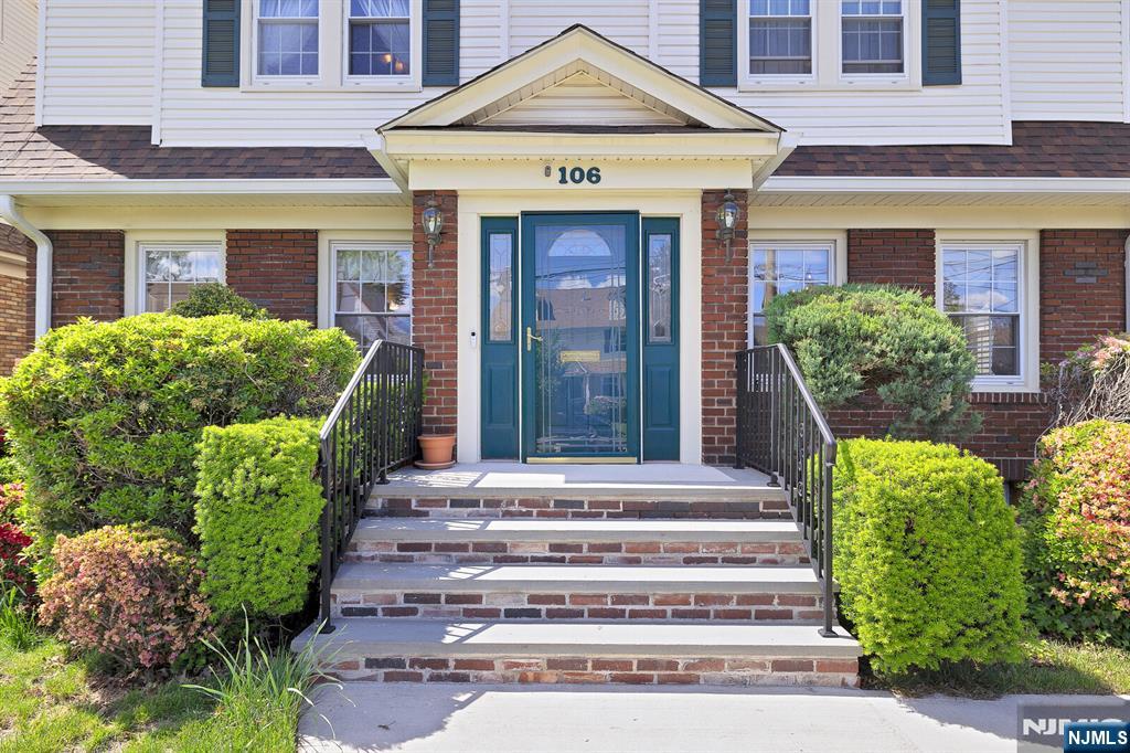 106 Maple Street Rutherford, NJ 07070 - Photo 4 of 50 a front view of a house with a garden