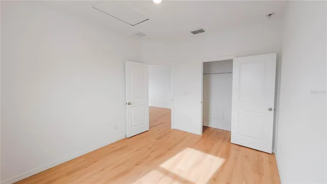 a bedroom with a bed and a table