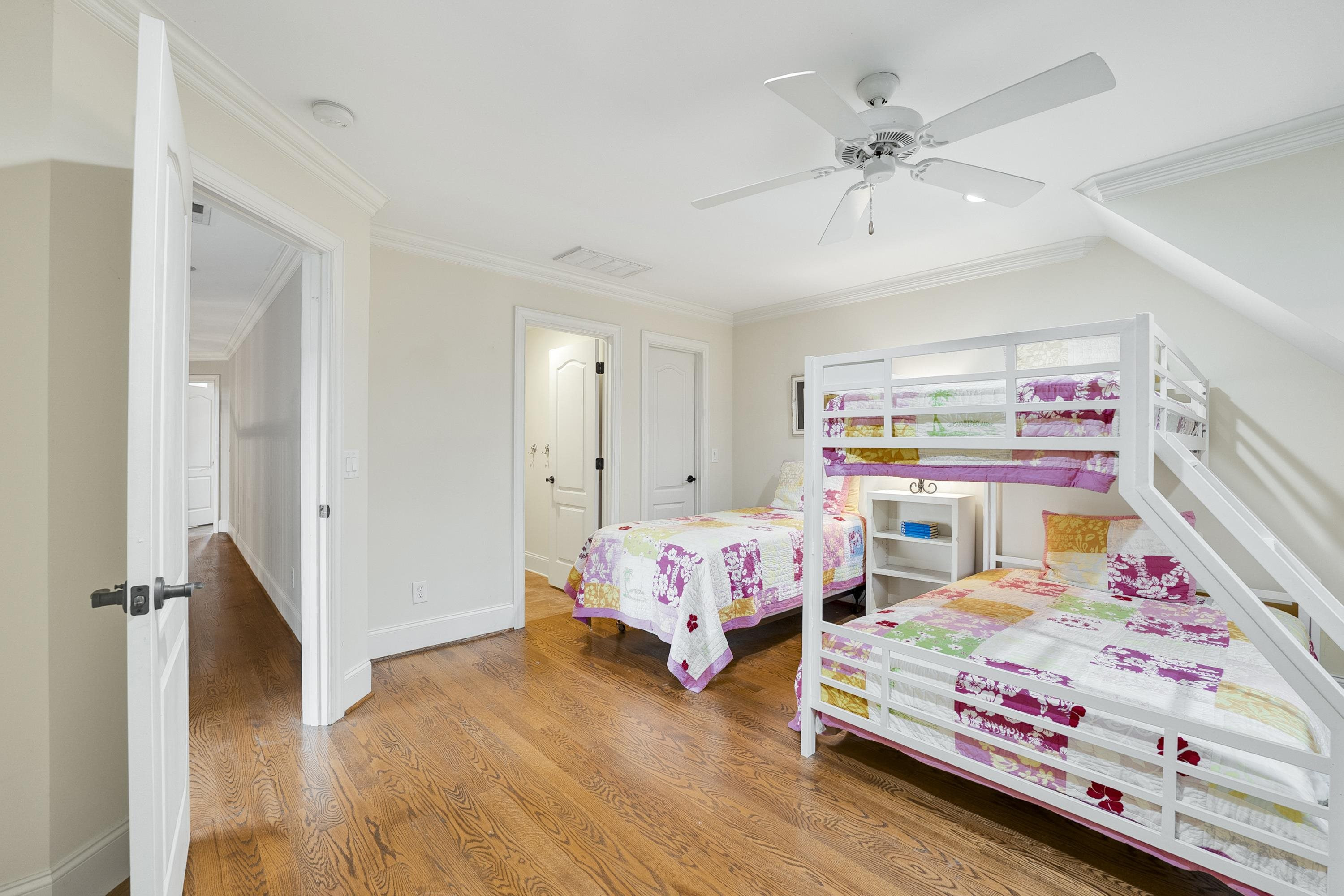 5401 Nicks Road Mebane, NC 27302 - Photo 22 of 53 a bedroom with bed and a chandelier