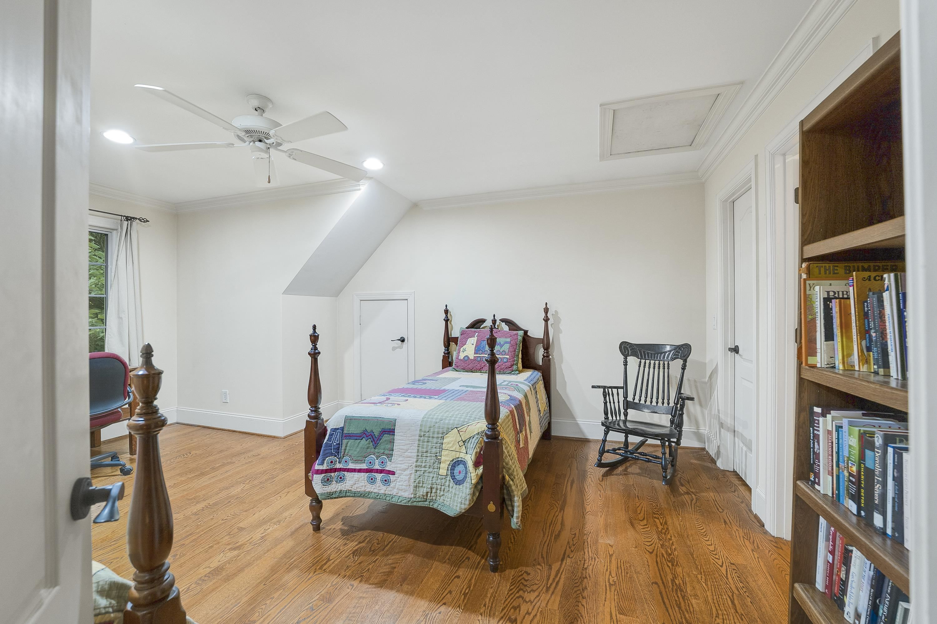 5401 Nicks Road Mebane, NC 27302 - Photo 24 of 53 a bedroom with furniture and a book shelf
